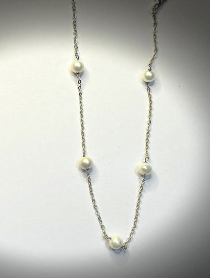 Spaced round pearl necklace